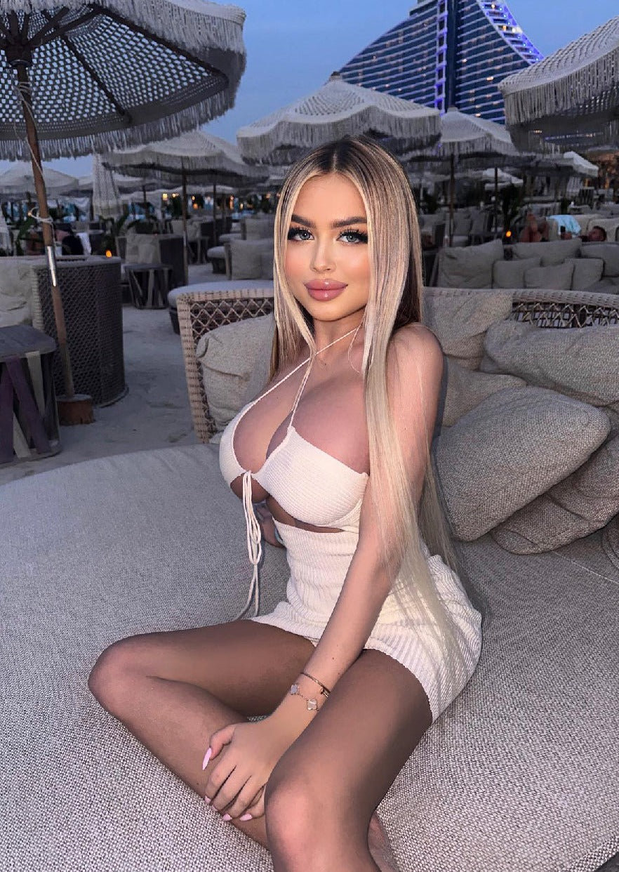 Girl in white knitted dress