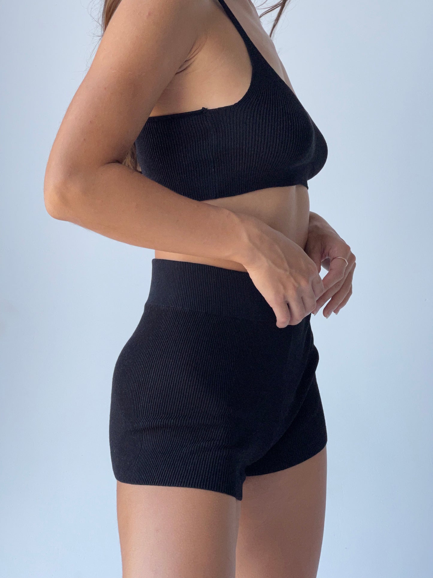 Girl in basic black shorts