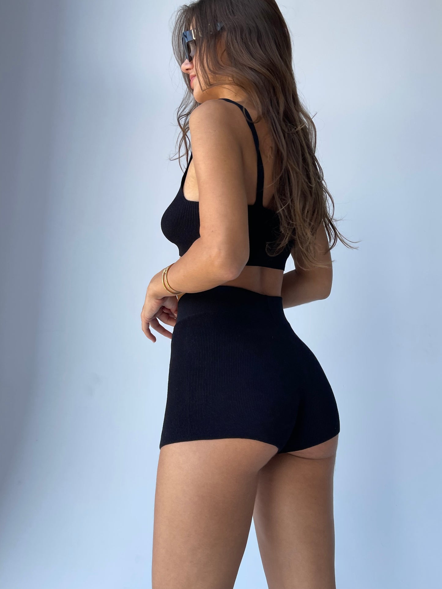 Girl in basic black shorts
