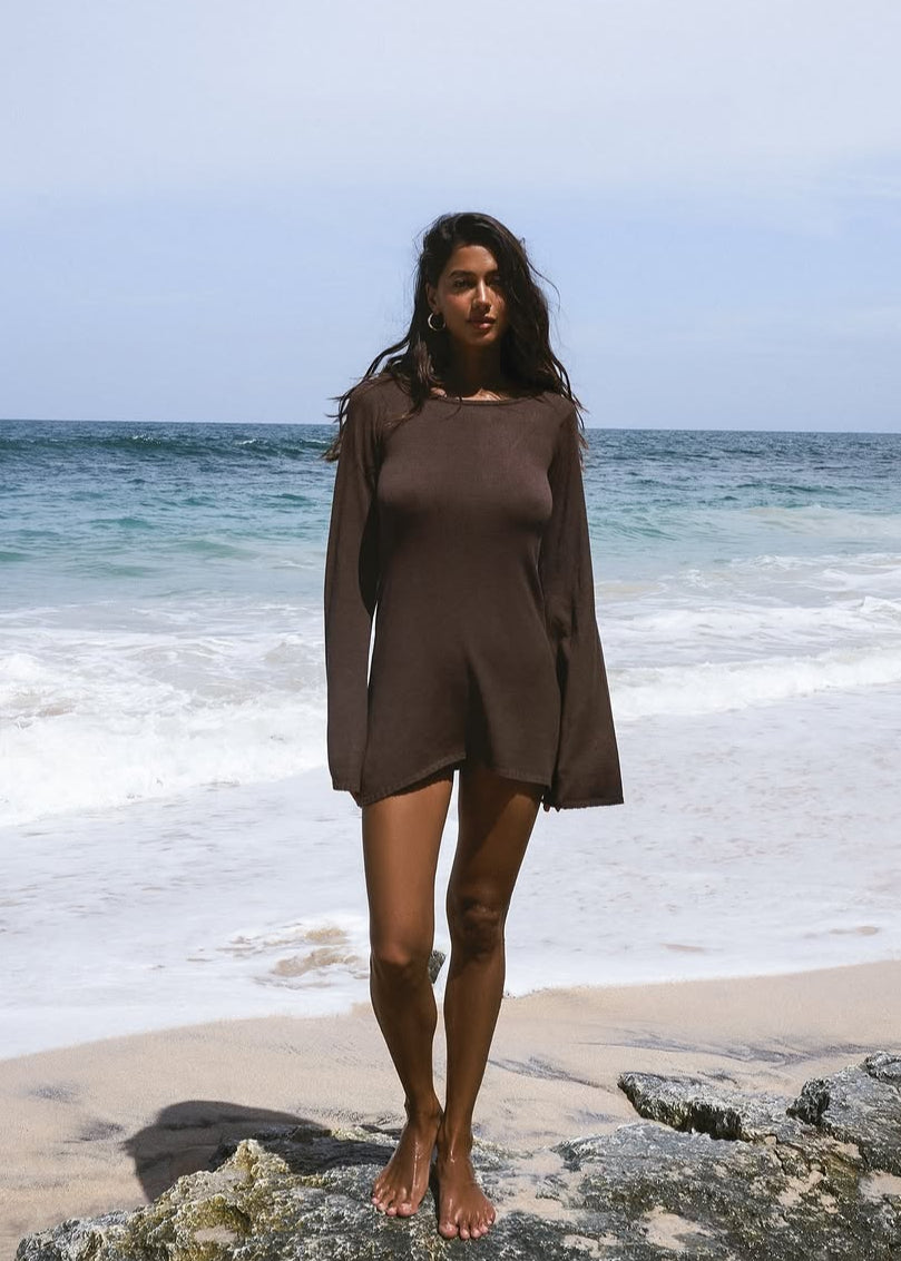 Girl in brown knitted dress