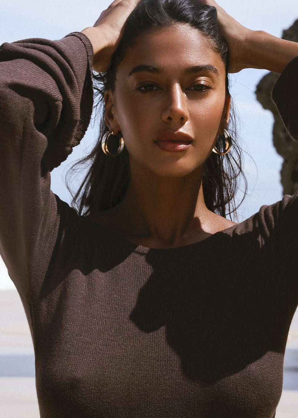 Girl in brown knitted dress
