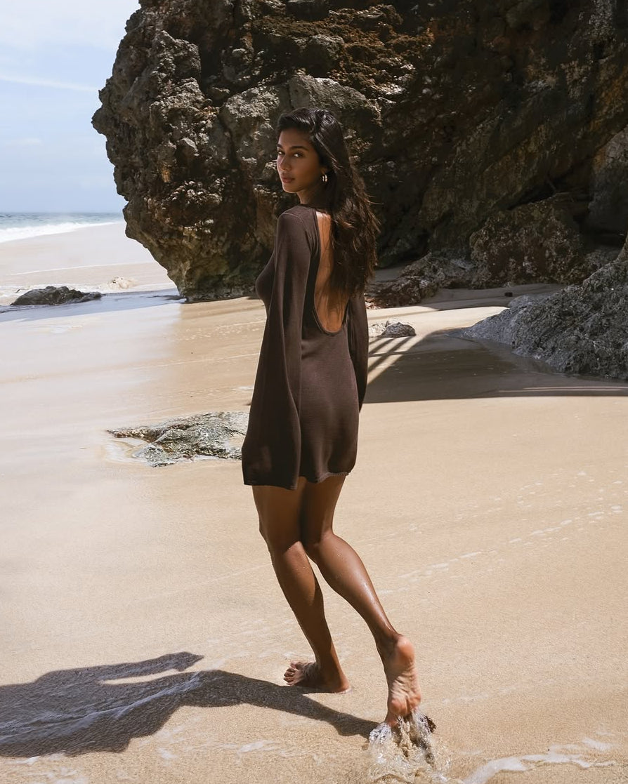 Girl in brown knitted dress