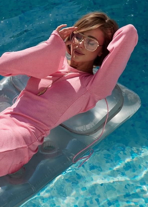 Girl in pink knitted dress