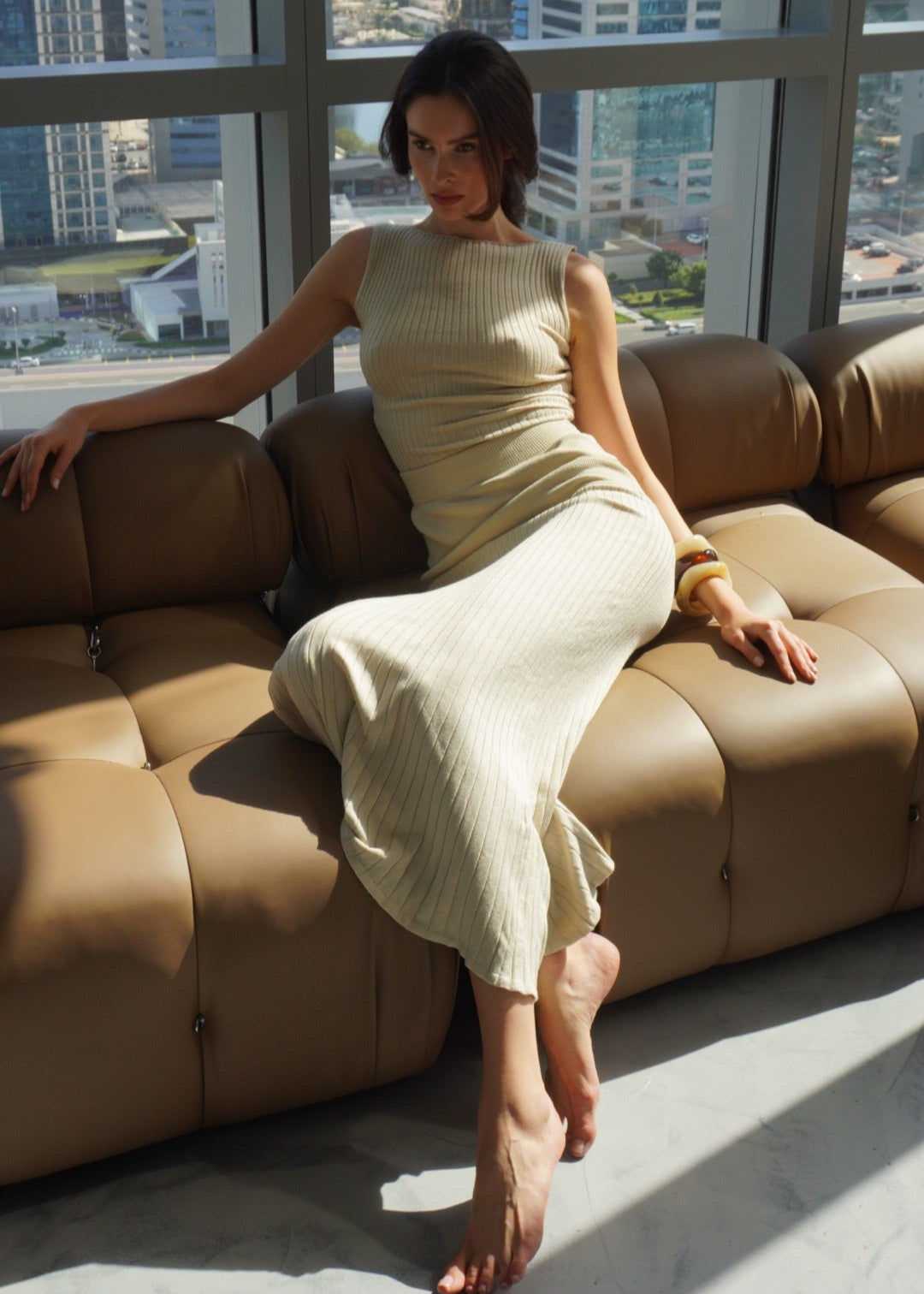 Girl in beige suit, long skirt and top