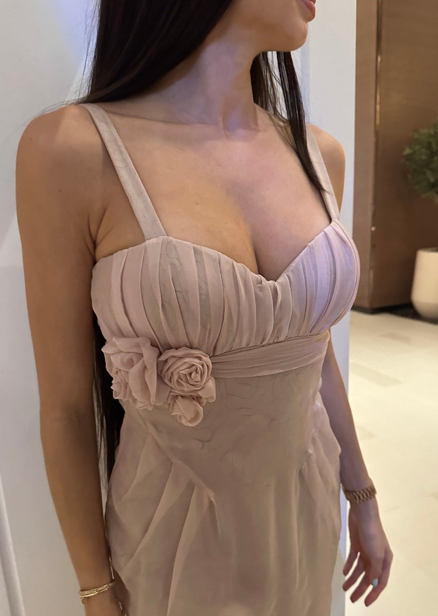 Girl in powder dress with flower