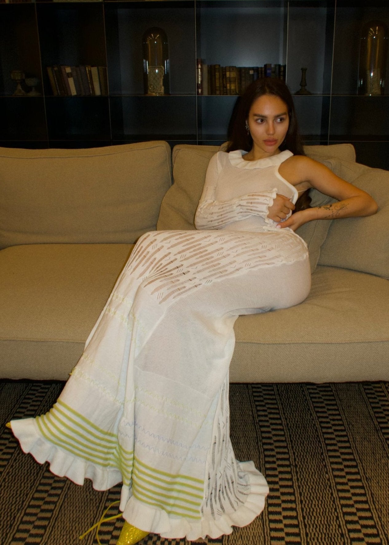 Girl in the long white dress with one sleeve
