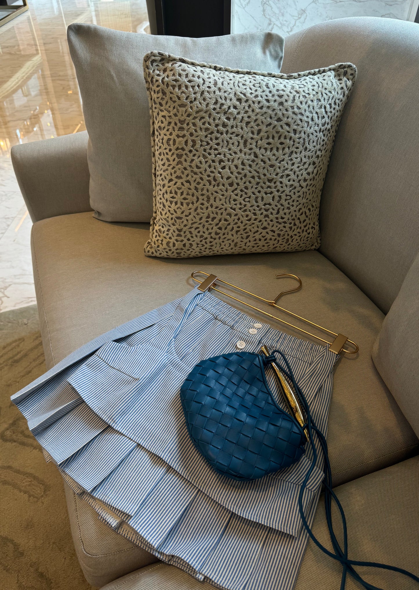 Details of the blue suit, top and skirt