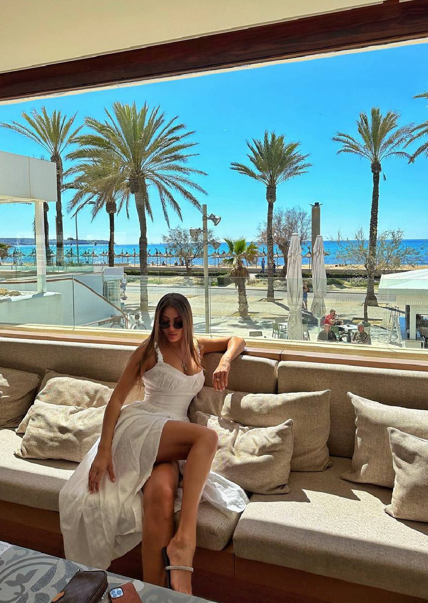 Girl in white linen dress