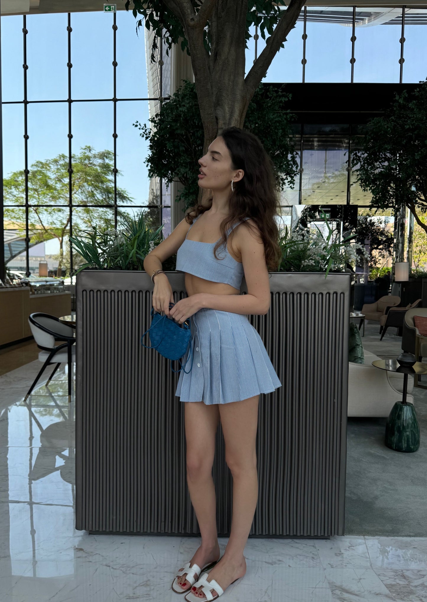 Girl in blue suit, top and skirt
