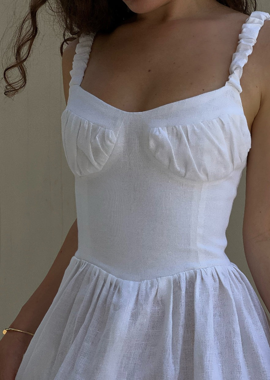 Girl in white linen dress