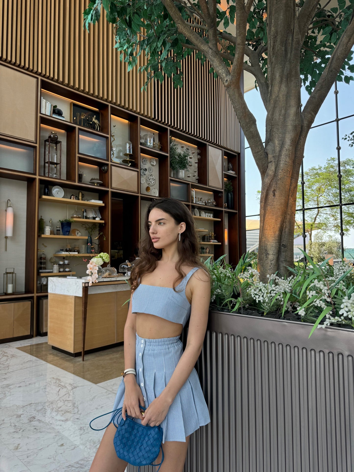 Girl in blue suit, top and skirt