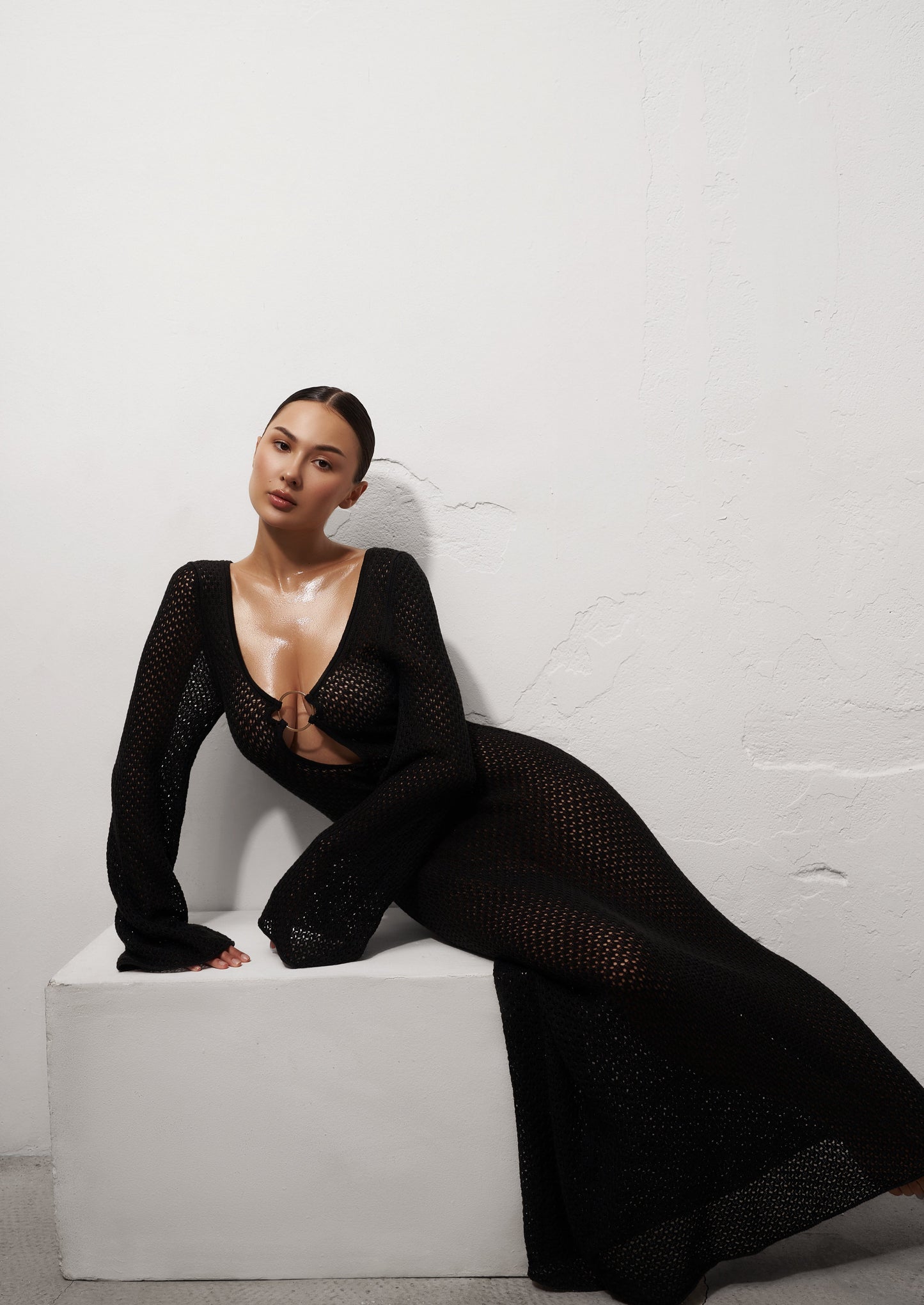 Girl in black long knitted dress