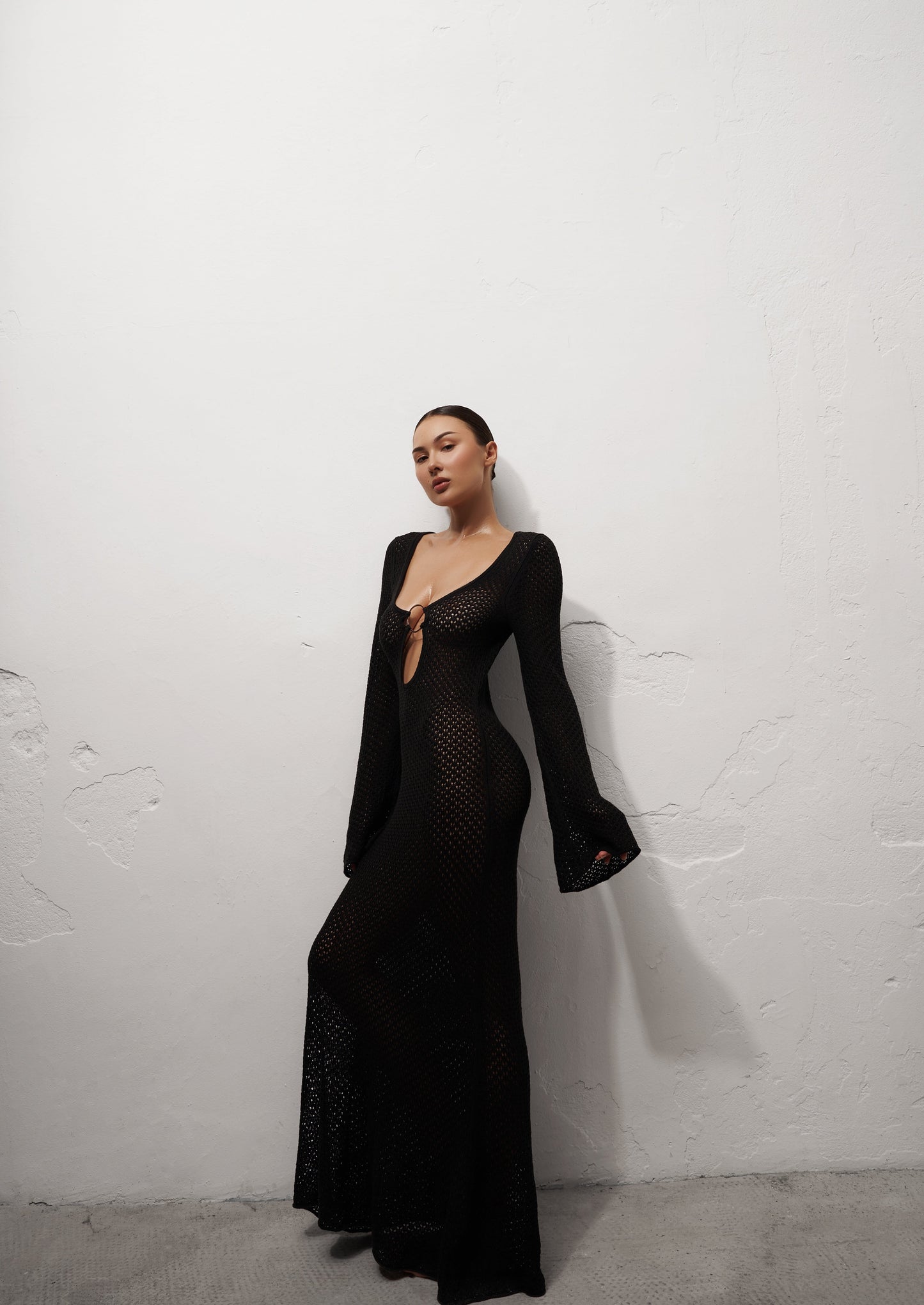 Girl in black long knitted dress