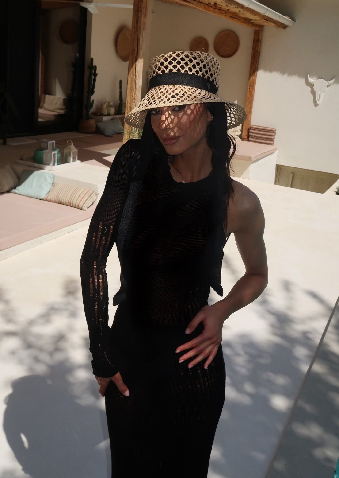 Girl in the long black dress with one sleeve