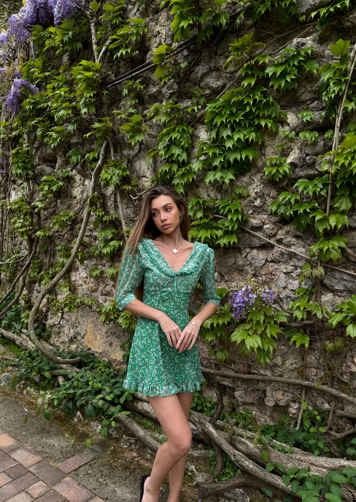 Girl in green dress with flowers