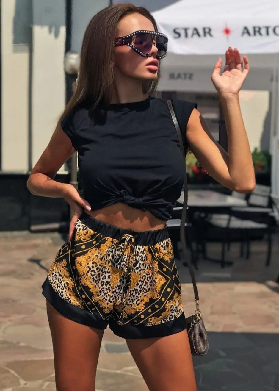 Girl in shorts Versace print