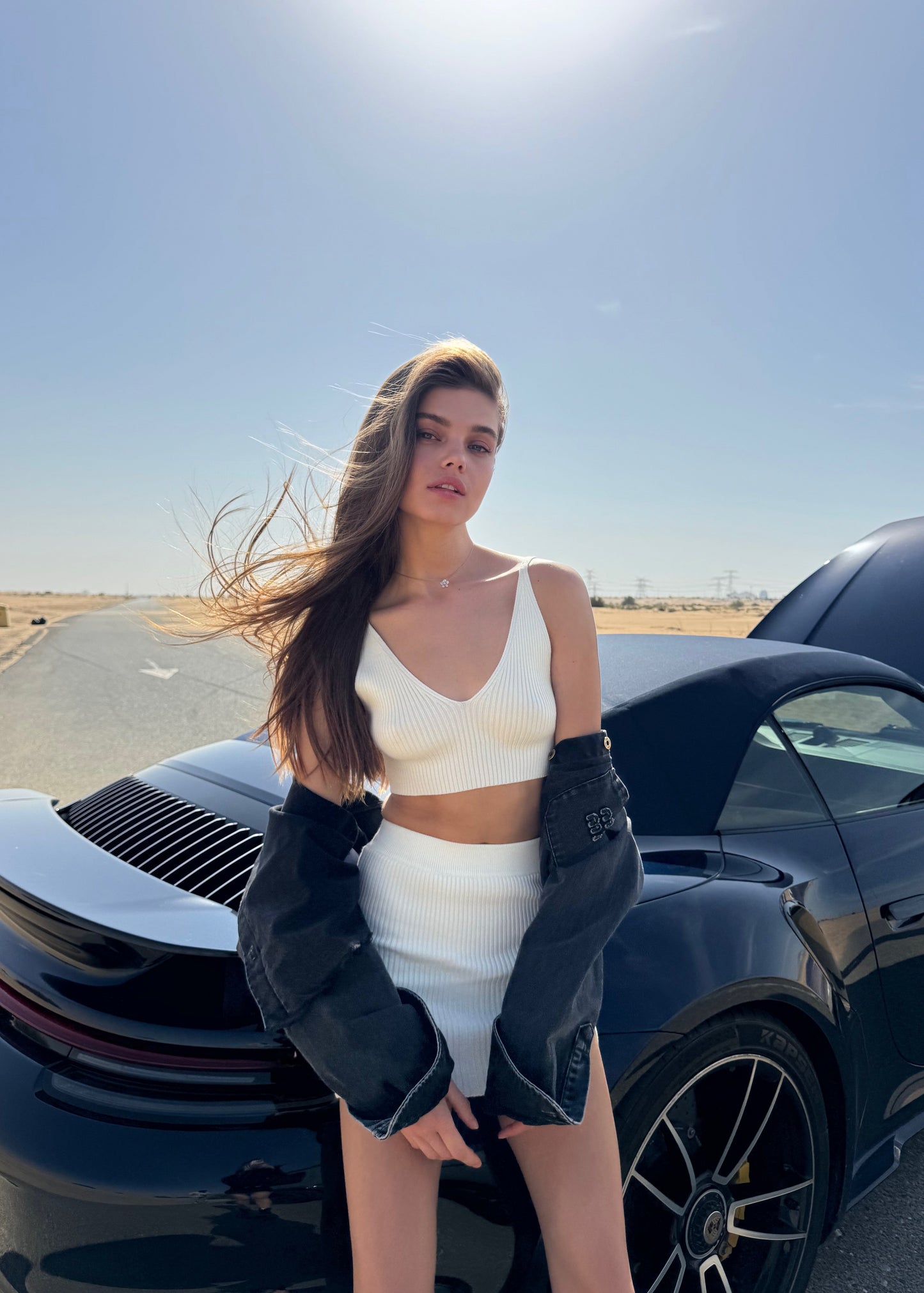 Girl in white suit short skirt and top