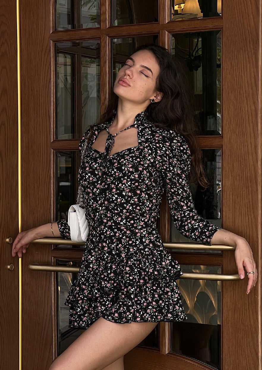 Girl in black dress with ties at the neck