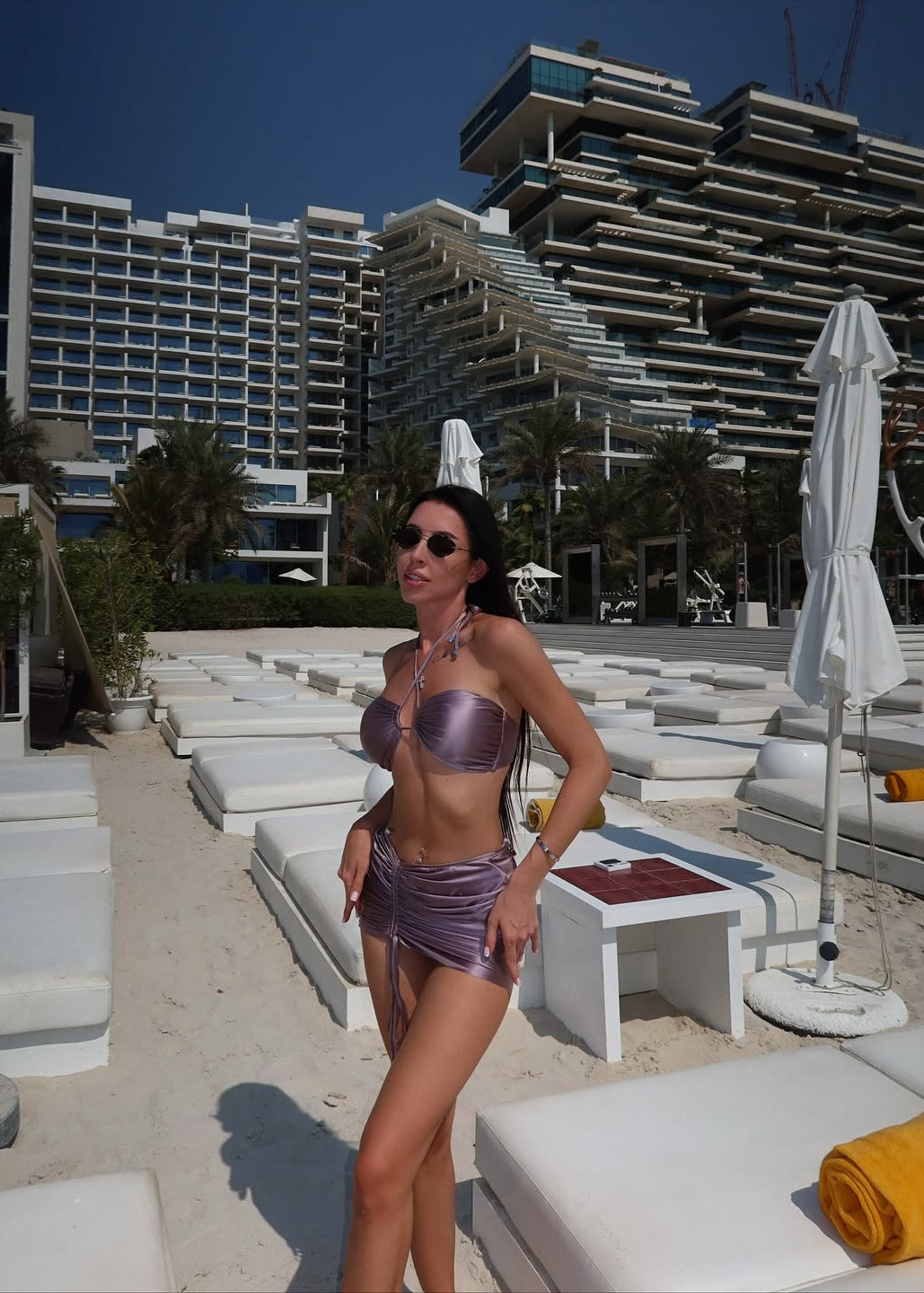 Girl in beige silk swimsuit