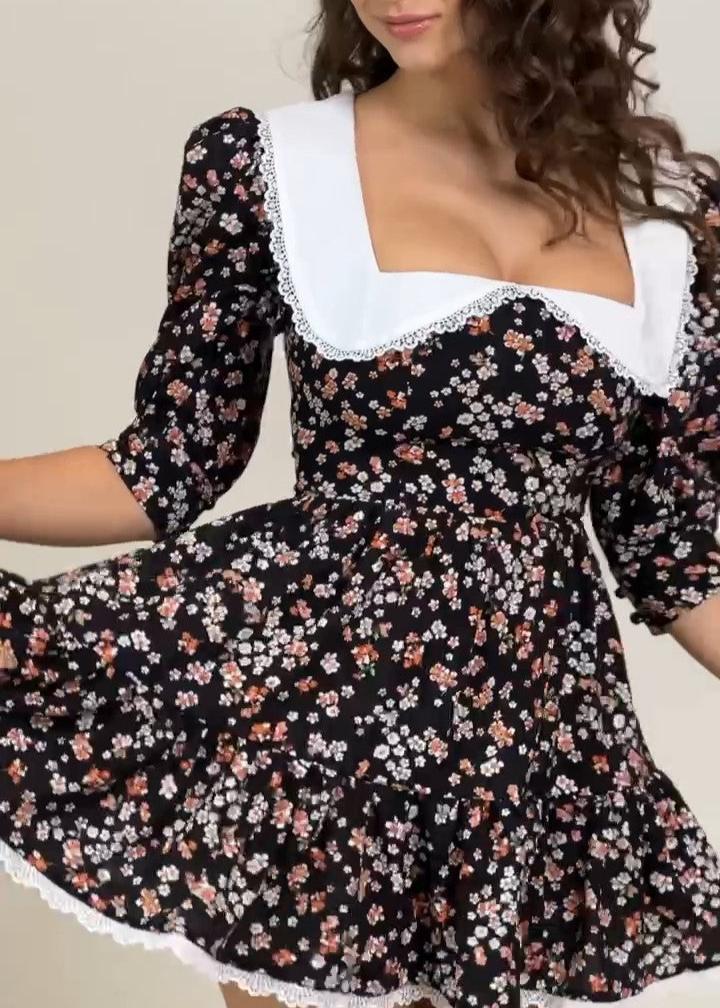 Girl in black floral dress