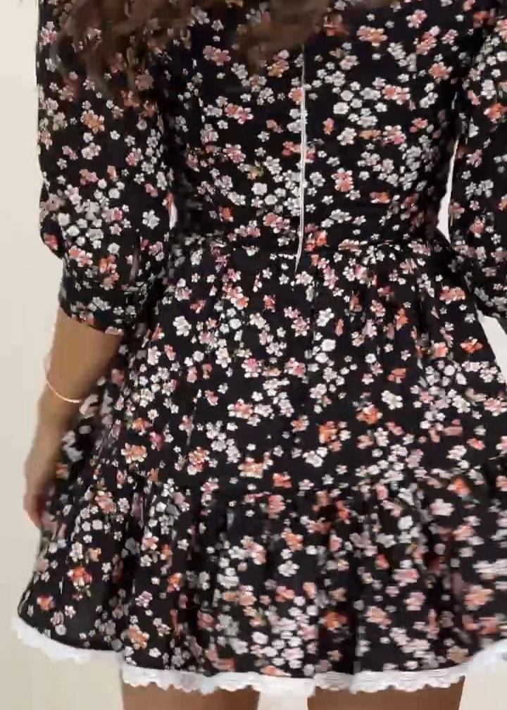 Girl in black floral dress