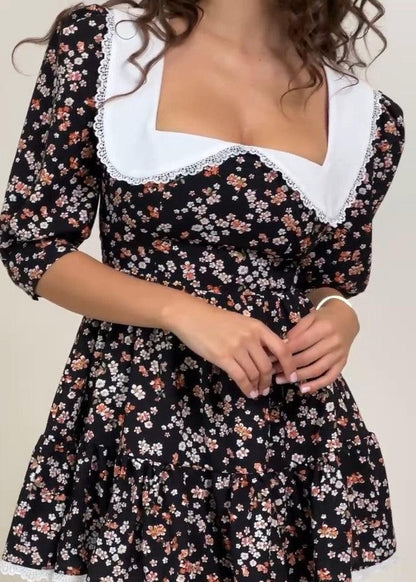 Girl in black floral dress