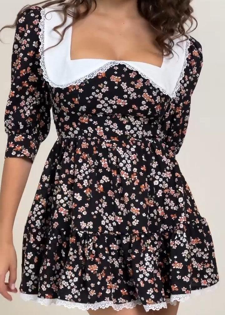 Girl in black floral dress