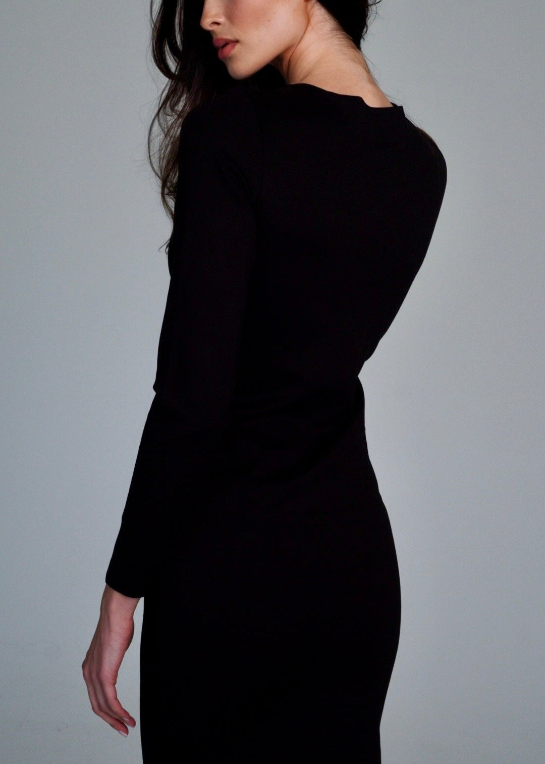 Girl in long black dress with long sleeves