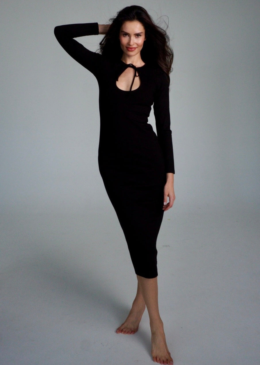 Girl in long black dress with long sleeves