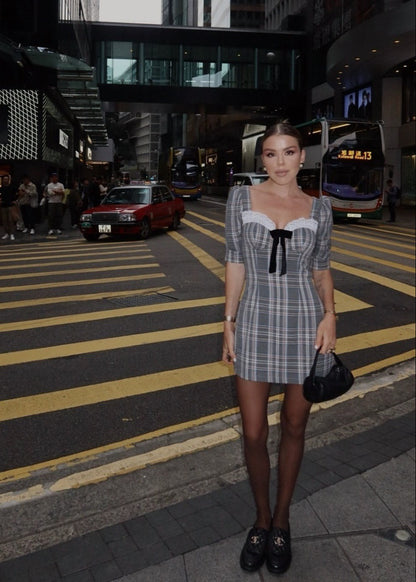 Girl in checkered grey dress