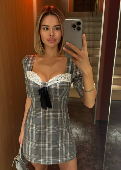 Girl in checkered grey dress