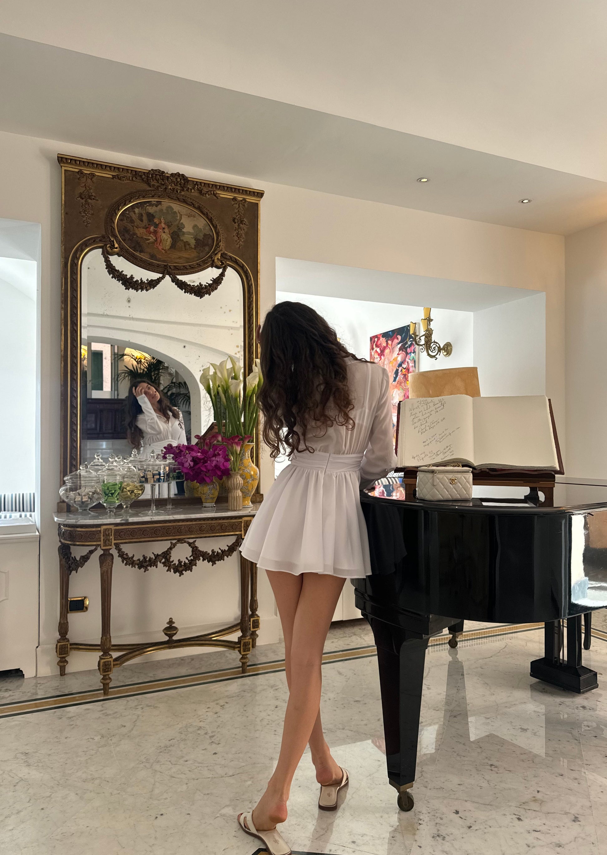 Girl in white dress with long sleeves