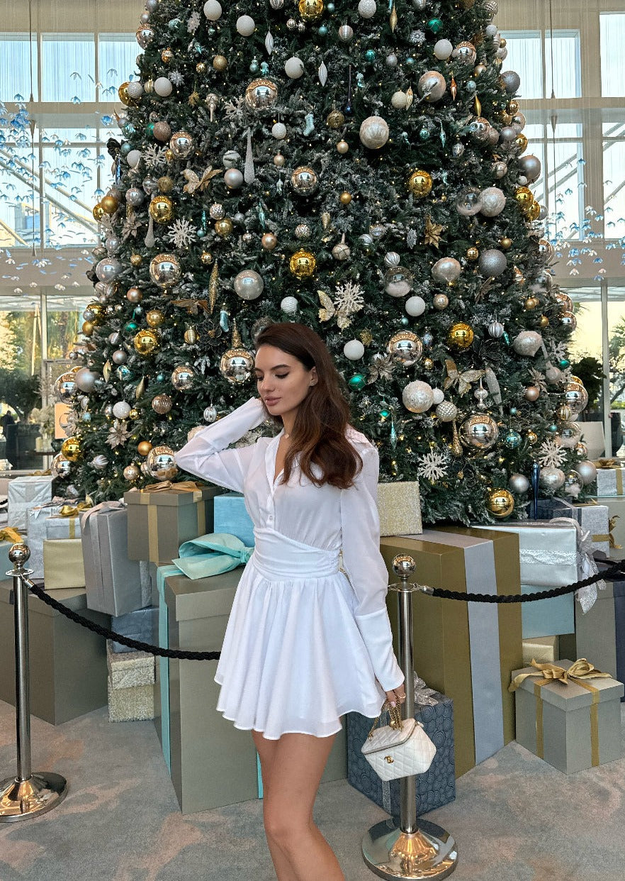 Girl in white dress with long sleeves