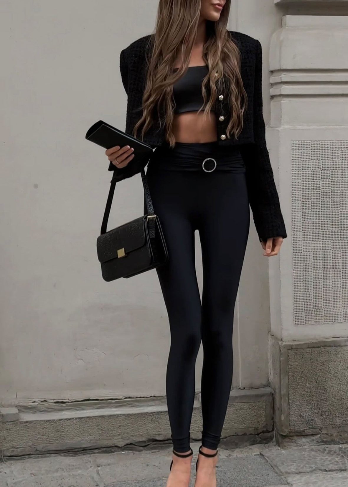 Girl in black leggings with buckle