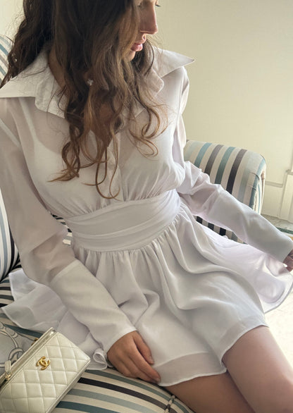 Girl in white dress with long sleeves