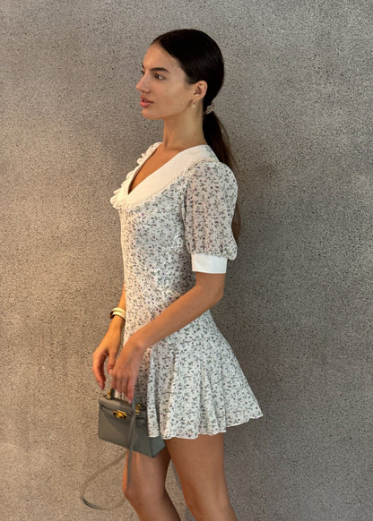 Girl in floral dress with white collar