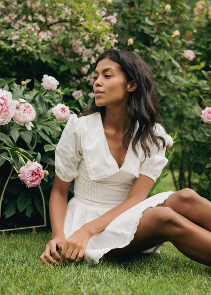 Girl in white dress with collar