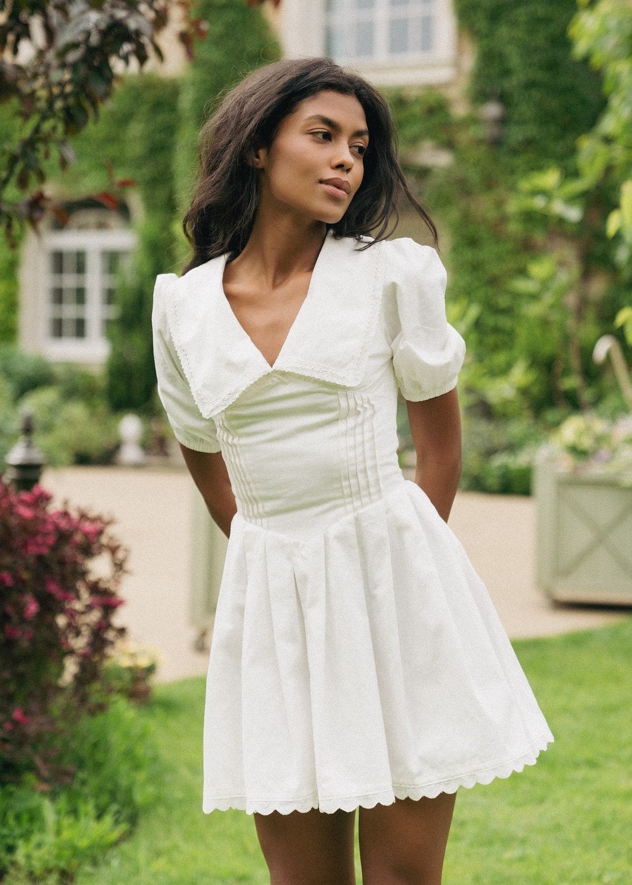 Girl in white dress with collar