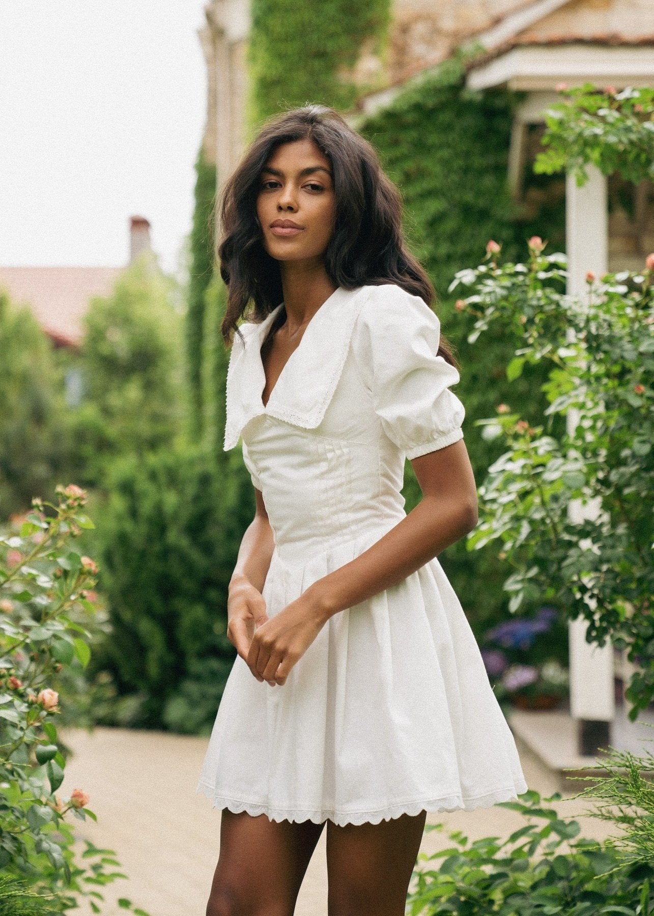 Girl in white dress with collar