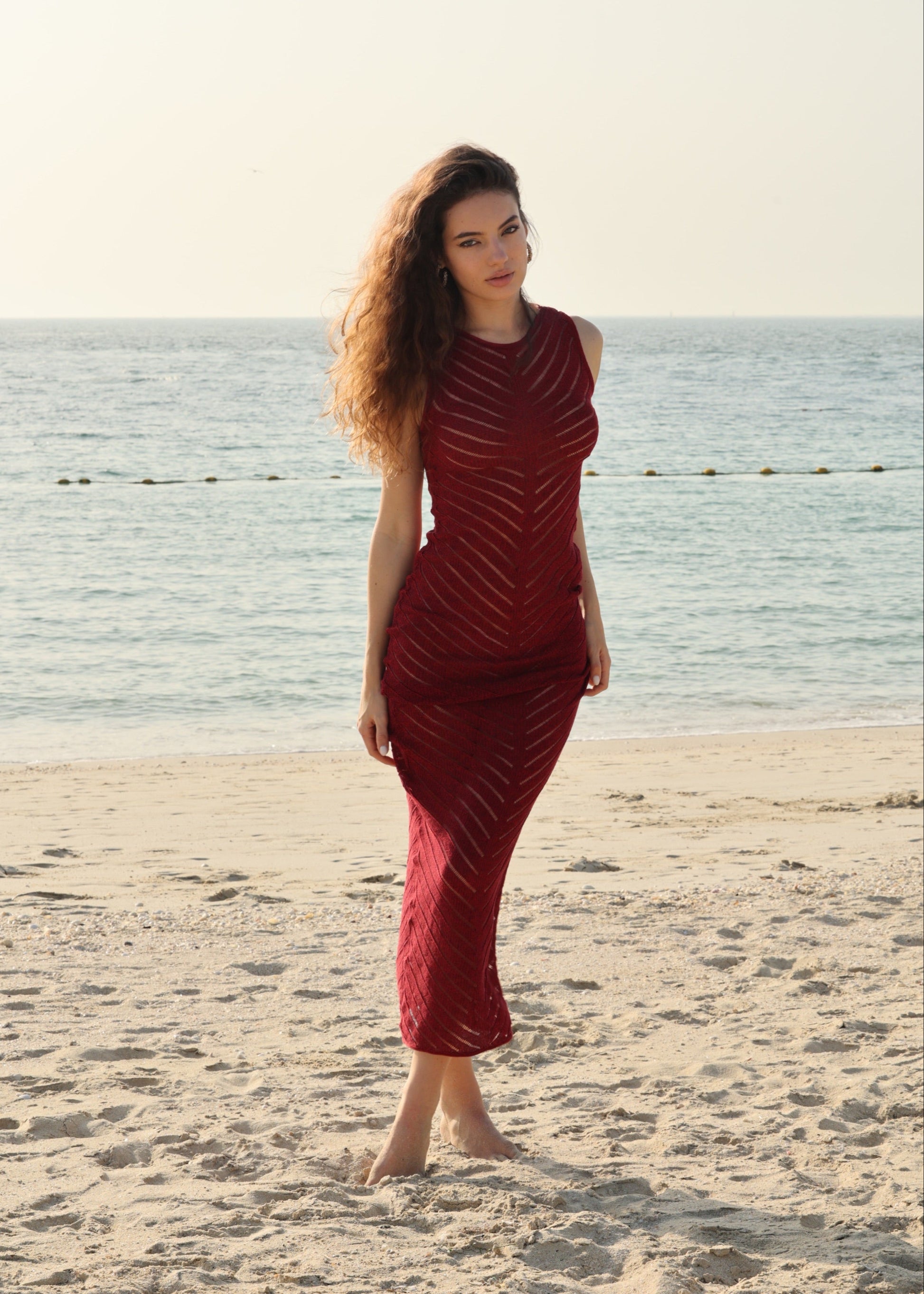 Girl in red  long knitted dress