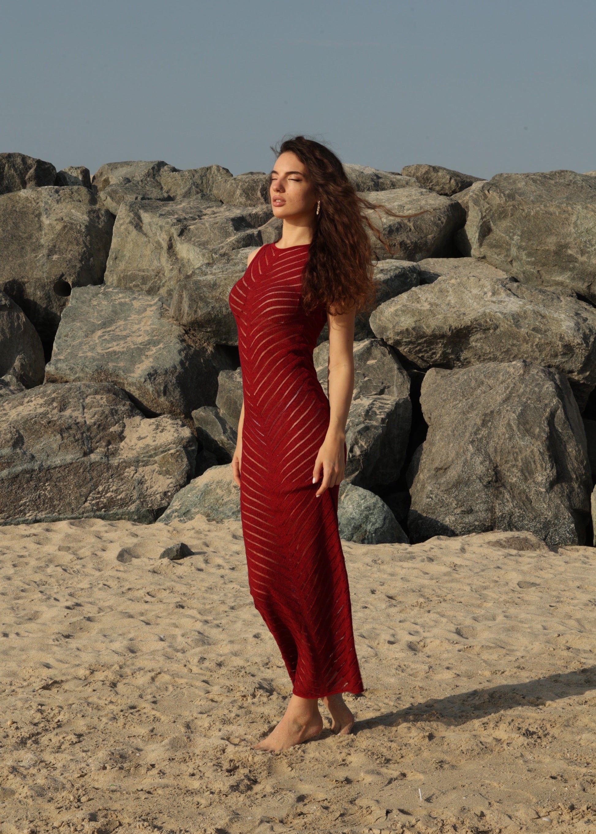Girl in red  long knitted dress