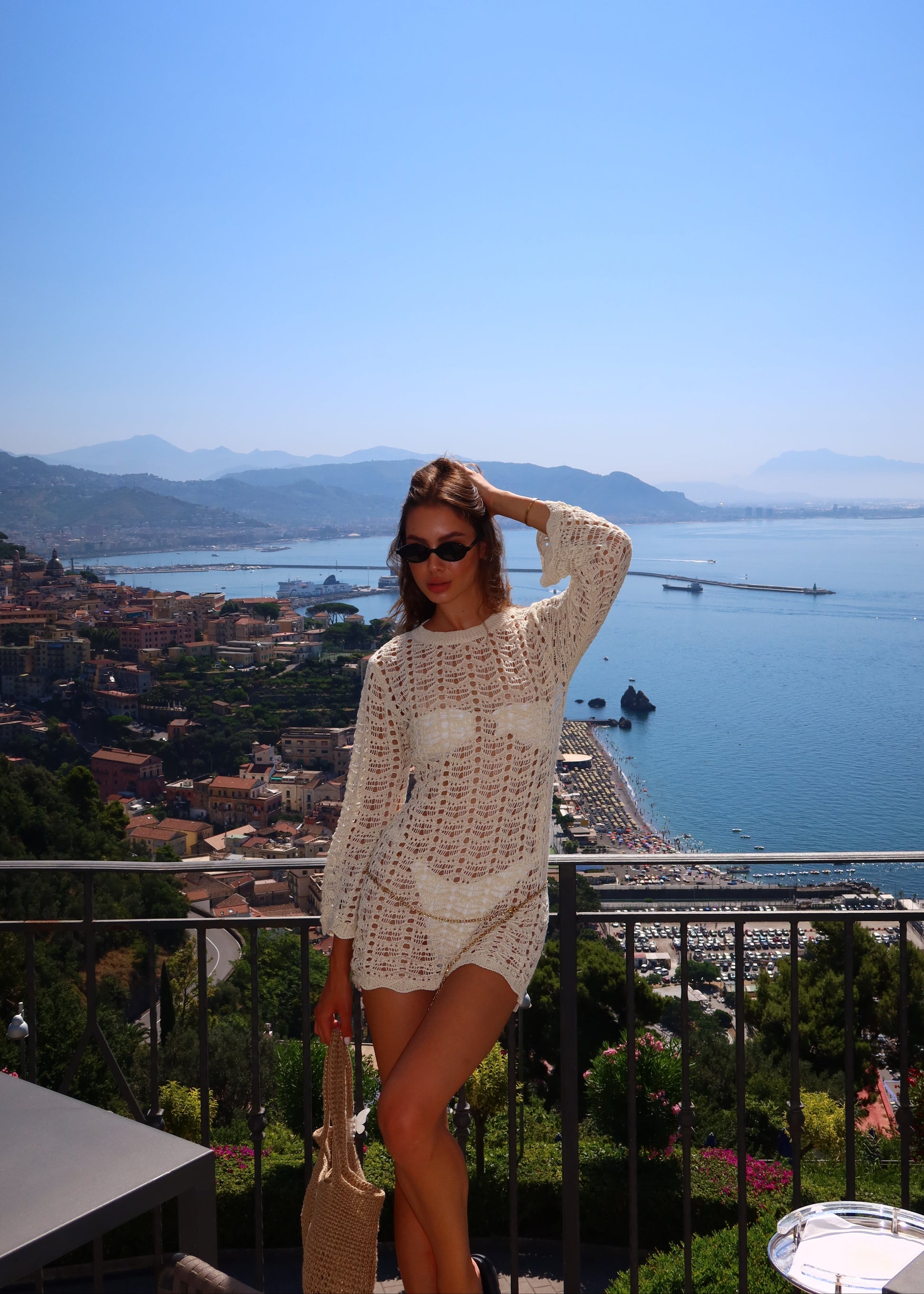 Girl in short knitted beach dress