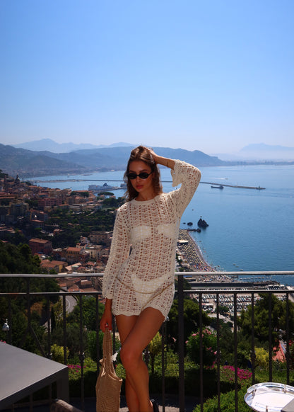 Girl in short knitted beach dress