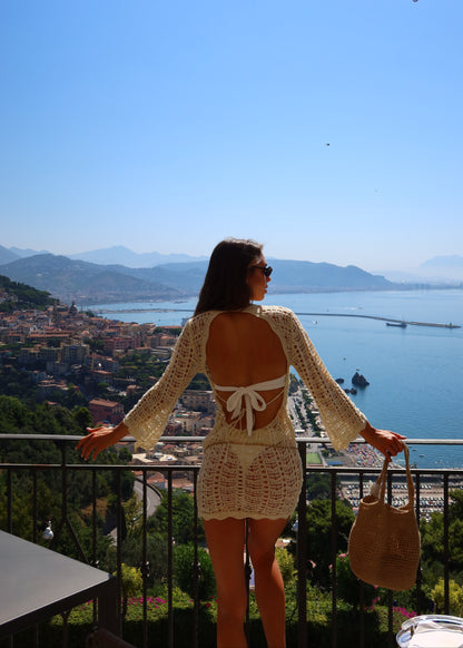 Girl in short knitted beach dress