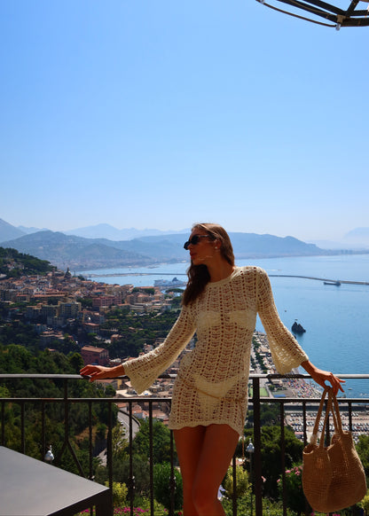 Girl in short knitted beach dress