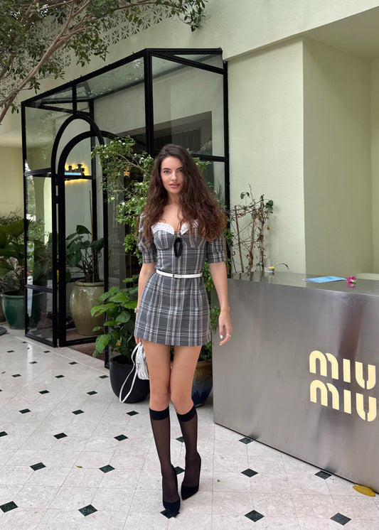 Girl in checkered grey dress