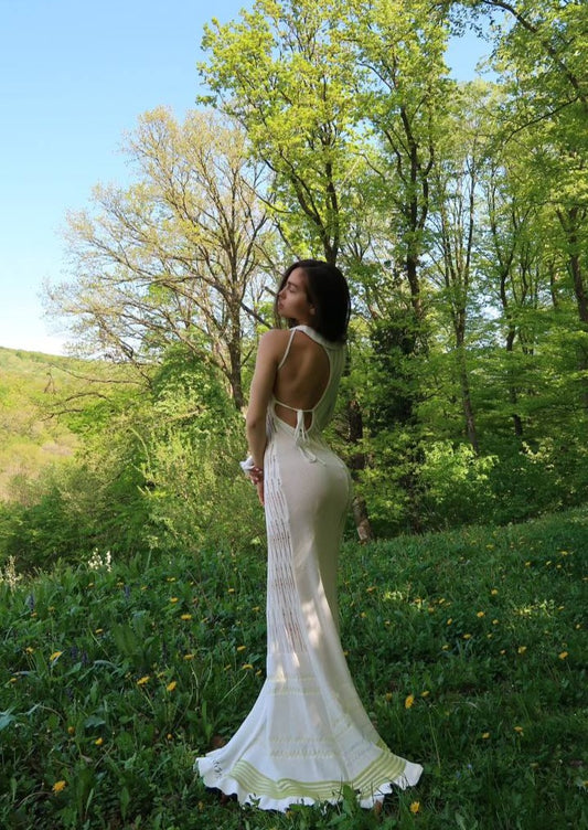 Girl in the long white dress with one sleeve