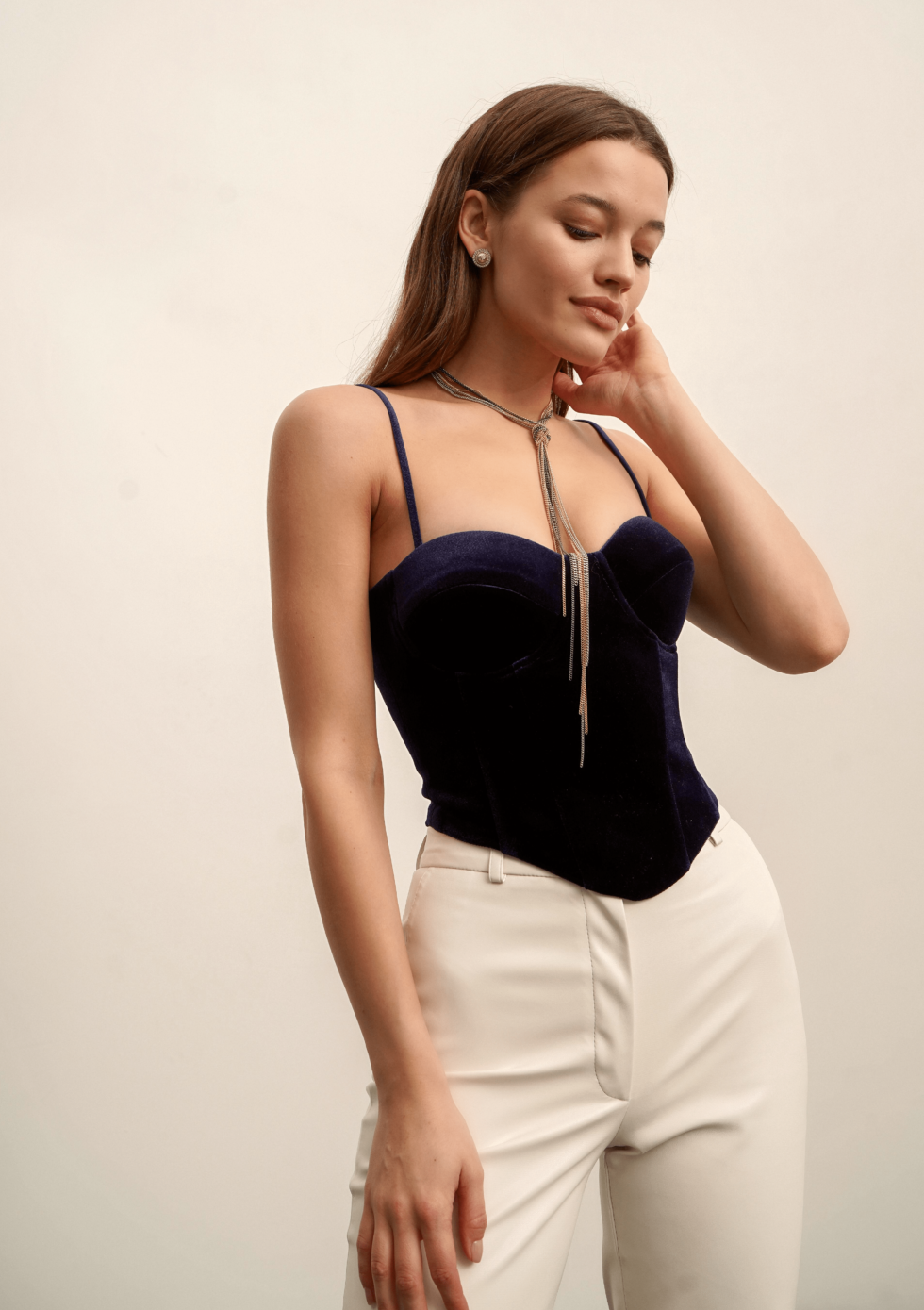 Girl in navy blue velvet corset