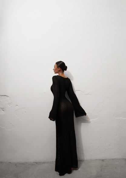 Girl in black long knitted dress
