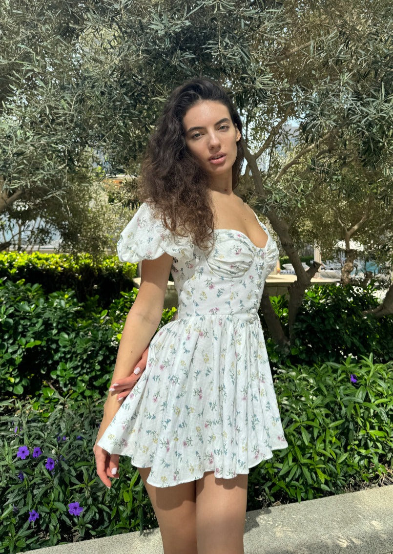 Girl in short white floral dress